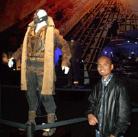 Posing with the Bane outfit used by Tom Hardy in THE DARK KNIGHT RISES, on December 7, 2012.