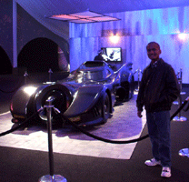 Posing with the Batmobile from Tim Burton's 1989 BATMAN film and BATMAN RETURNS at L.A. Live, on December 7, 2012.