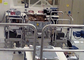 A camera phone pic of the Curiosity rover chassis.