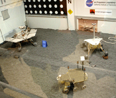 Engineering models of Mars rovers inside the In-Situ Instrument Laboratory.