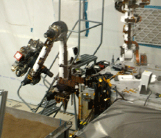 An engineering model of the Curiosity rover inside the In-Situ Instrument Laboratory.