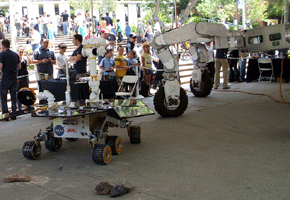 The giant lunar rover prototype and a Mars Exploration Rover test model.