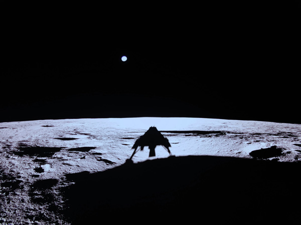 The shadow of Firefly Aerospace's Blue Ghost lander is visible on the lunar landscape at Mare Crisium...as Earth lurks in the far distance on March 2, 2025