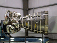 An SSME is displayed near space shuttle Endeavour inside the Samuel Oschin Pavilion.