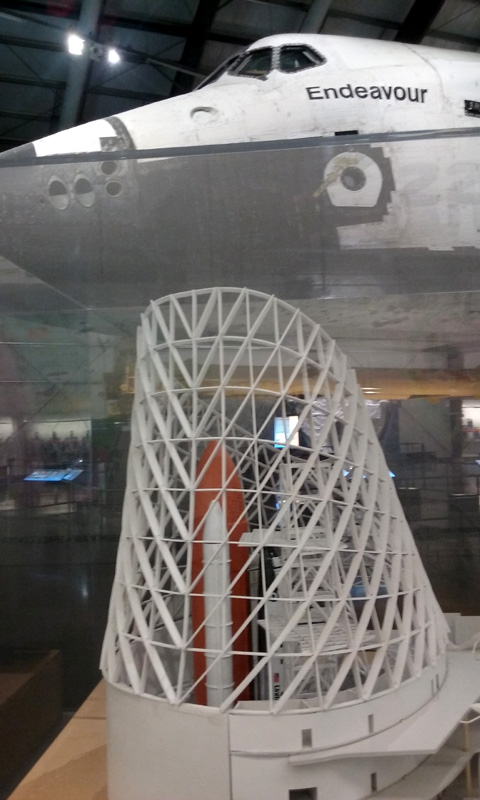 The model of the Samuel Oschin Air and Space Center with Endeavour in the background, as of June 2016.