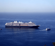 A Catalina Express sails past the ocean liner...and is headed back to the California mainland on October 4, 2013.