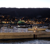 From aboard the boat, dusk continues to fall upon Avalon Bay at Catalina Island...on October 4, 2013.