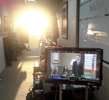 The Sun shines into a hallway outside of the set for COFFEE, KILL BOSS