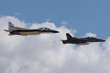 Two NASA aircraft - an F-15 Eagle and F/A-18D Hornet - conduct an aerial demo during the Aerospace Valley Air Show at Edwards Air Force Base, California...on October 15, 2022.