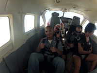 Kickin' back as the aircraft reaches jumping altitude above Lake Elsinore, CA...on October 4, 2014.