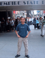 In front of the main entrance to the Empire State Building.