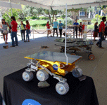 Life-size models of the Sojourner and Mars Exploration Rovers (MER), respectively.