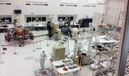 The Mars 2020 descent and cruise stages (the latter is visible towards the right edge of this photo) on display inside JPL's SAF...on June 9, 2018.