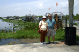 Mom and Dad posing in front of the airboats that take folks on tours through the 'River of Grass.'