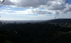 With Century City and Culver City visible in the background, smoke is seen rising from a nearby hill in Hollywood...on January 21, 2017.