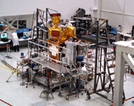 Clad in bunny suits, engineers work on the SMAP satellite inside the SAF clean room at NASA JPL...on September 8, 2014.