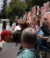 Holding Spirit Mars panorama posters as the group photo is taken.