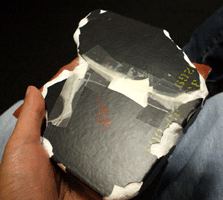 Holding a space shuttle tile!