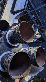 A close-up on Atlantis' Space Shuttle Main Engines and Orbital Maneuvering System nozzles.