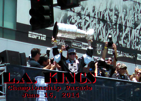 The Stanley Cup trophy is hoisted into the air by team center Anze Kopitar during the L.A. Kings' championship parade on June 16, 2014.