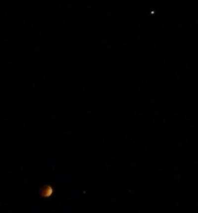 A smartphone photo that I took of the Blood Moon and Mars (upper right-hand corner) during the total lunar eclipse on April 15, 2014.