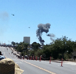 During a combat demo, two AH-1 Cobra attack helicopters fly towards an explosion at Miramar MCAS...on September 24, 2016.