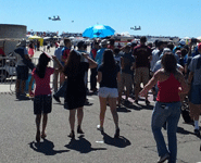 Onlookers watch as two V-22 Ospreys fly over the airfield at Miramar MCAS...on September 24, 2016.