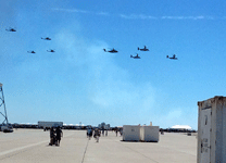 The three V-22 Ospreys, the lone MH-53 Pave Low chopper, two AH-1 Cobras and a pair of UH-1 Iroquois helicopters fly over the airfield at Miramar MCAS on September 24, 2016.