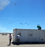 Flying above the V-22 Ospreys and the other helicopters are a C-130 Hercules cargo plane, two AV-8B Harrier II jump jets and a pair of F/A-18 Hornets...on September 24, 2016.