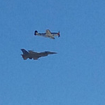 The P-51 Mustang and the F-16 Fighting Falcon fly alongside each other during an air demo above Miramar MCAS...on September 24, 2016.