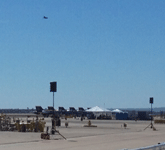 The F-35B Lightning II flies above the Blue Angels parked on the tarmac at Miramar MCAS...on September 24, 2016.