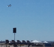 With the Blue Angels below it, the F-35B Lightning II flies away after conducting a VTOL demonstration above the airfield at Miramar MCAS...on September 24, 2016.