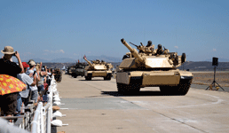 A column of Marine armored vehicles, including two M1A1 Abrams tanks, rolls down the tarmac at Marine Corps Air Station (MCAS) Miramar...on September 29, 2018.