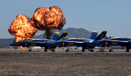 Two fireballs erupt behind the Blue Angels during the Marine air-ground task force (MAGTF) demo at the Miramar Air Show...on September 29, 2018.