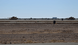 Two M1A1 Abrams tanks roll down the runway during the MAGTF demo on September 29, 2018.