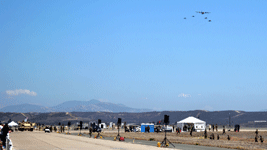 The C-130 Hercules, two AV-8B Harriers and the pair of F/A-18 Hornets prepare to fly over the runway at MCAS Miramar...on September 29, 2018.