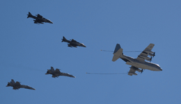 The C-130 Hercules, two AV-8B Harriers and the pair of F/A-18 Hornets fly over MCAS Miramar at the conclusion of the MAGTF demo...on September 29, 2018.