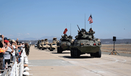 The rest of the armored column, led by two LAV-25 Light Armored Vehicles, rolls down the tarmac at MCAS Miramar...on September 29, 2018.