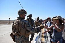 U.S. Marines greet spectators after the MAGTF demo at the Miramar Air Show...on September 29, 2018.
