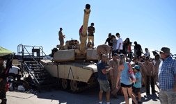 A crowd gathers around an M1A1 Abrams tank on display at the Miramar Air Show...on September 29, 2018.