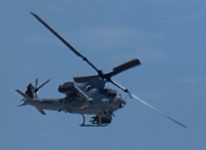 An AH-1 Cobra is on the attack during the MAGTF demo at the Miramar Air Show in San Diego, California...on September 24, 2022.
