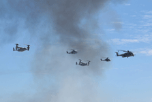 The two V-22 Ospreys, AH-1 Cobra, UH-1 Iroquois and CH-53 Sea Stallion fly in formation near the end of the MAGTF demo at the Miramar Air Show...on September 24, 2022.