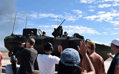 Spectators watch as an Amphibious Combat Vehicle drives by at the end of the Miramar Air Show's MAGTF demo...on September 24, 2022.