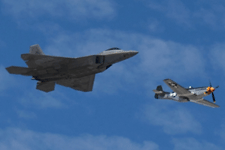 The F-22 Raptor and P-51 Mustang fly in unison during a U.S. Air Force Heritage Flight demo at the Miramar Air Show...on September 24, 2022.