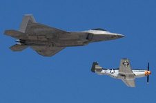 The F-22 Raptor and P-51 Mustang fly in unison during a U.S. Air Force Heritage Flight demo at the Miramar Air Show...on September 24, 2022.