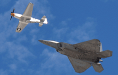 The F-22 Raptor and P-51 Mustang fly in unison during a U.S. Air Force Heritage Flight demo at the Miramar Air Show...on September 24, 2022.