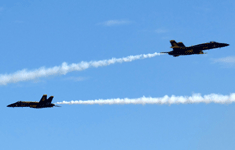 Two of the six Blue Angels conduct an acrobatic maneuver during the final demo at the Miramar Air Show...on September 24, 2022.