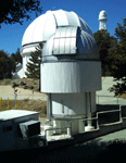 A CHARA Array interferometer (foreground), the dome housing the 60-inch telescope (middle) and one of the 150-foot solar telescopes (background)...on March 24, 2016.