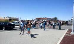 A crowd of NASA Social attendees, Armstrong employees and media personnel watch as the F/A-18 conducts the sonic boom demonstration...on May 31, 2016.