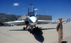 The pilot who conducted today's sonic boom demo poses near the F/A-18 Hornet...on May 31, 2016.